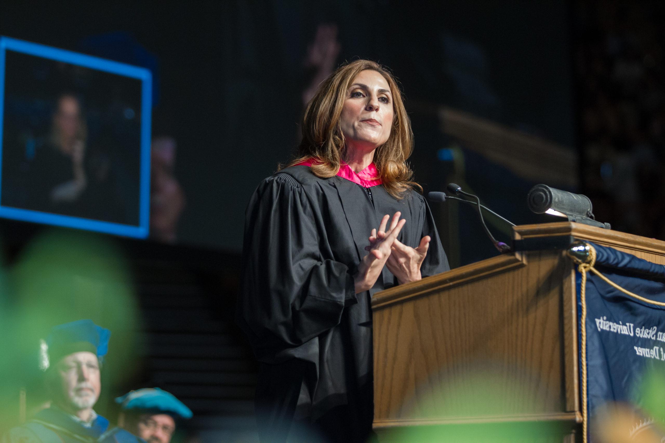Gayle Tzemach Lemmon speaking at the commencement podium.